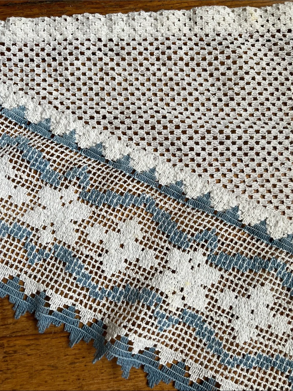Set of curtain swags with Blue Trim.
